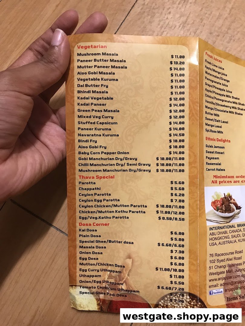 A detailed menu from Anjappar, showcasing a variety of South Indian vegetarian and non-vegetarian dishes, juices, and desserts.