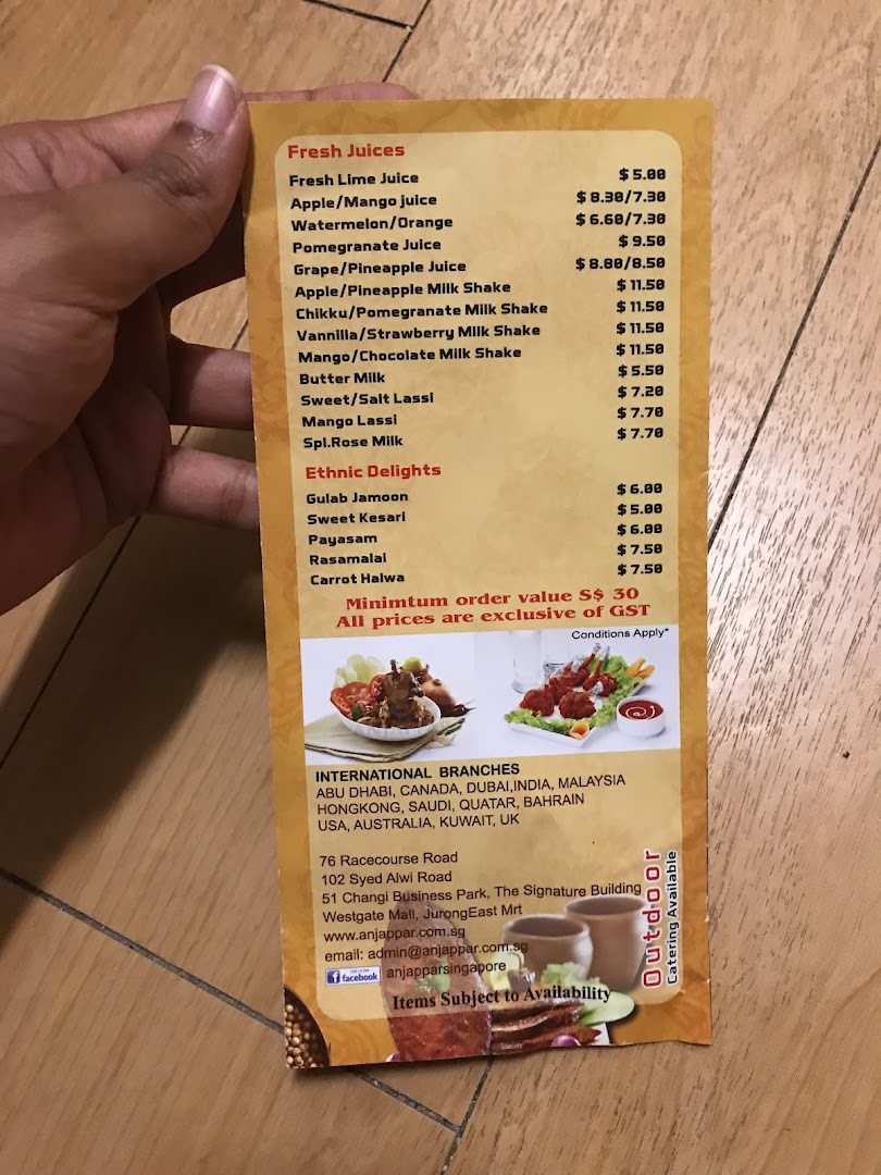 A close-up view of Anjappar's menu, featuring fresh juices and ethnic delights with prices.