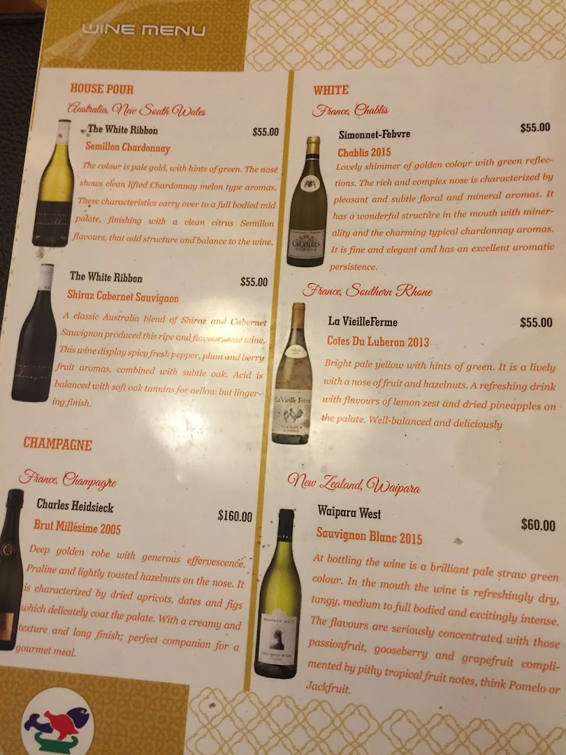 A detailed wine menu featuring a selection of house pour, white, and champagne options with prices.