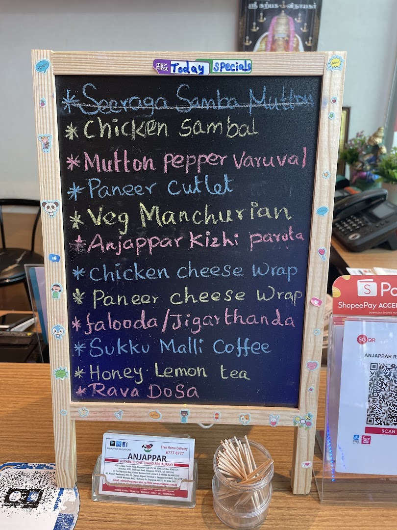 A blackboard displaying Anjappar's daily specials and menu items.