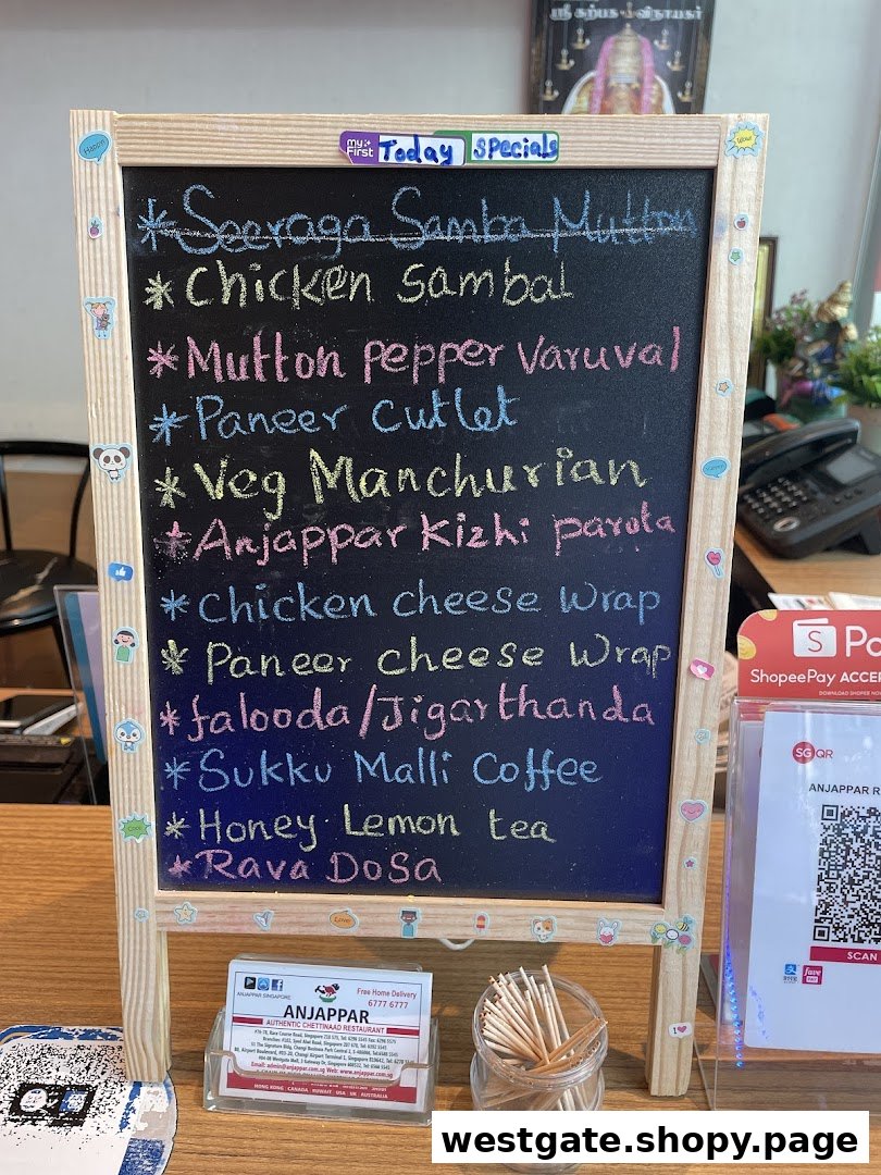 A blackboard displaying Anjappar's daily specials and menu items.