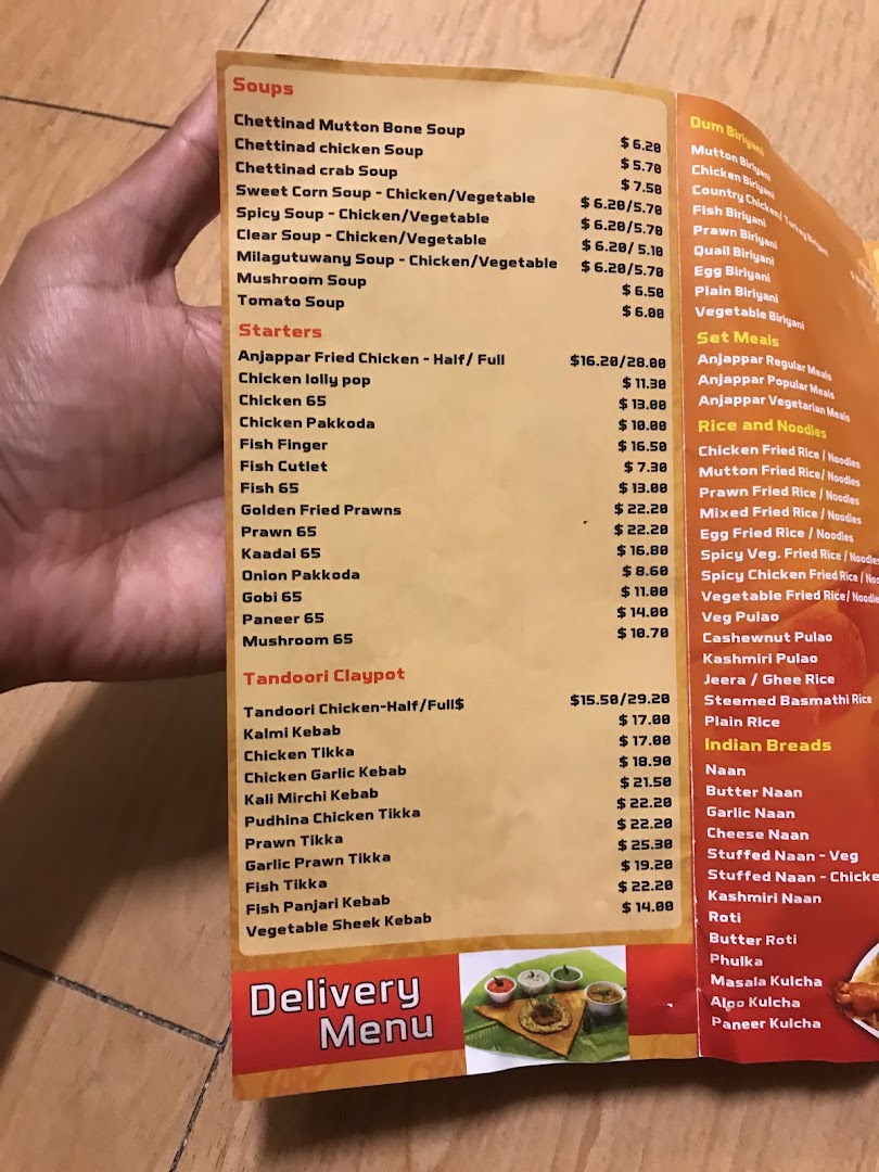A close-up view of Anjappar's extensive menu, featuring South Indian and Chettinad cuisine options.