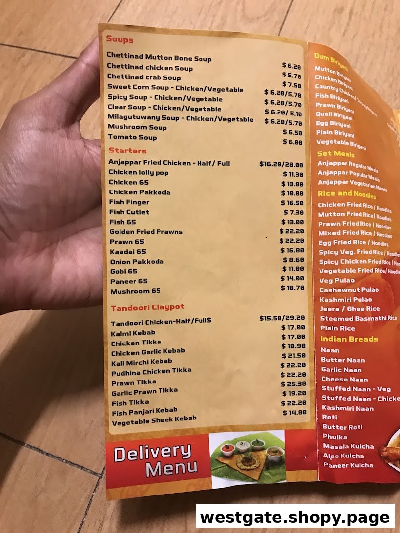 A close-up view of Anjappar's extensive menu, featuring South Indian and Chettinad cuisine options.