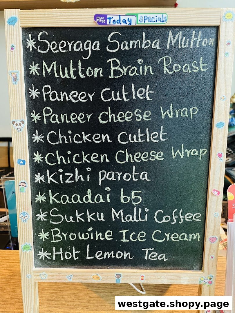 A blackboard displaying Anjappar's daily specials and menu items written in chalk.
