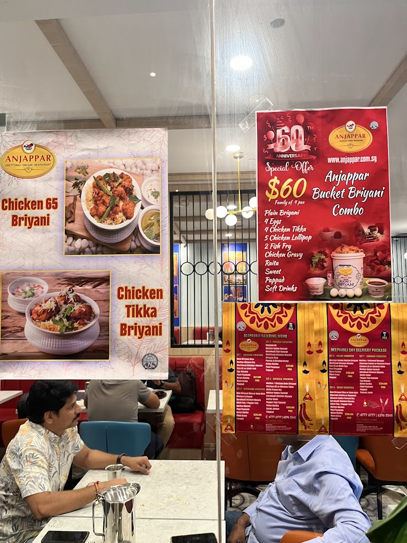 Interior view of Anjappar restaurant showcasing special offers and Deepavali catering menus.
