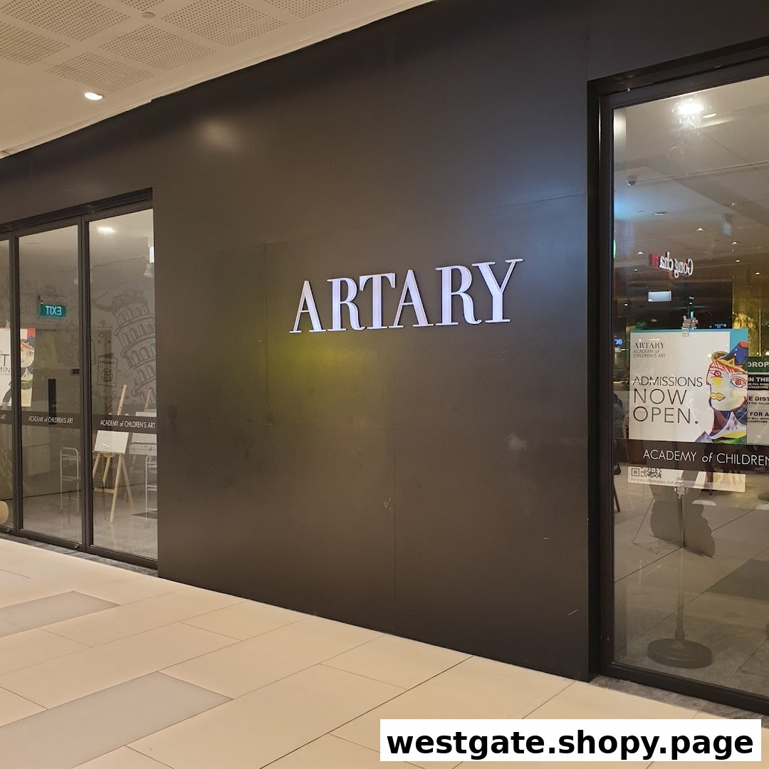 The shopfront of ARTARY, an academy of children's art, featuring its illuminated sign and entrance.
