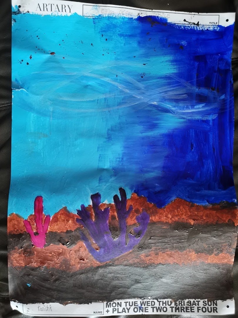 A vibrant child's painting of an underwater scene with coral, showcasing artistic creativity.