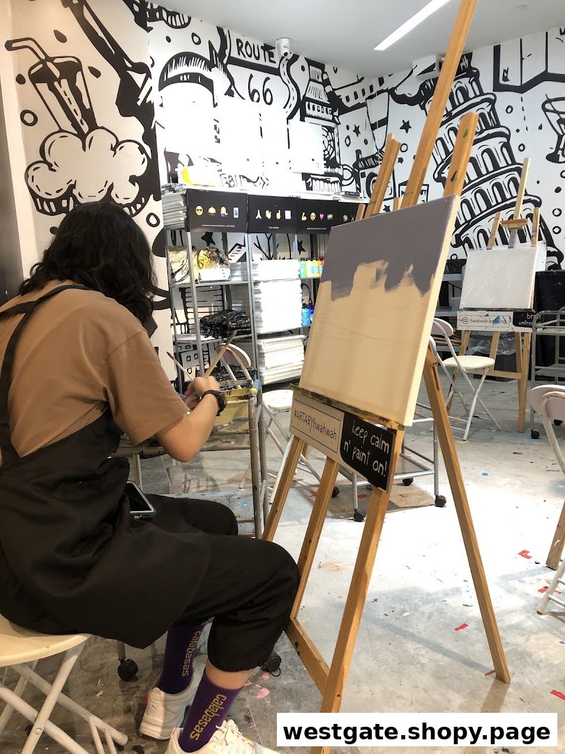A person painting on an easel in a vibrant art studio with creative wall murals.