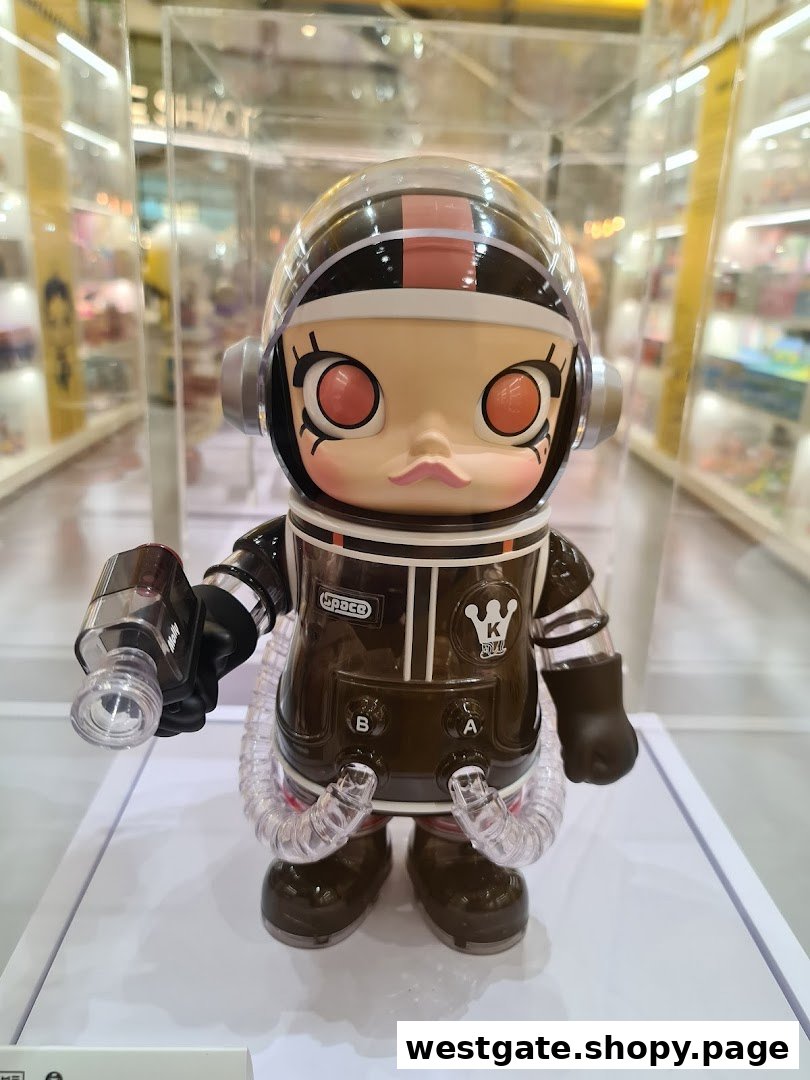 A detailed close-up of a Molly astronaut collectible figurine on display in a retail store.