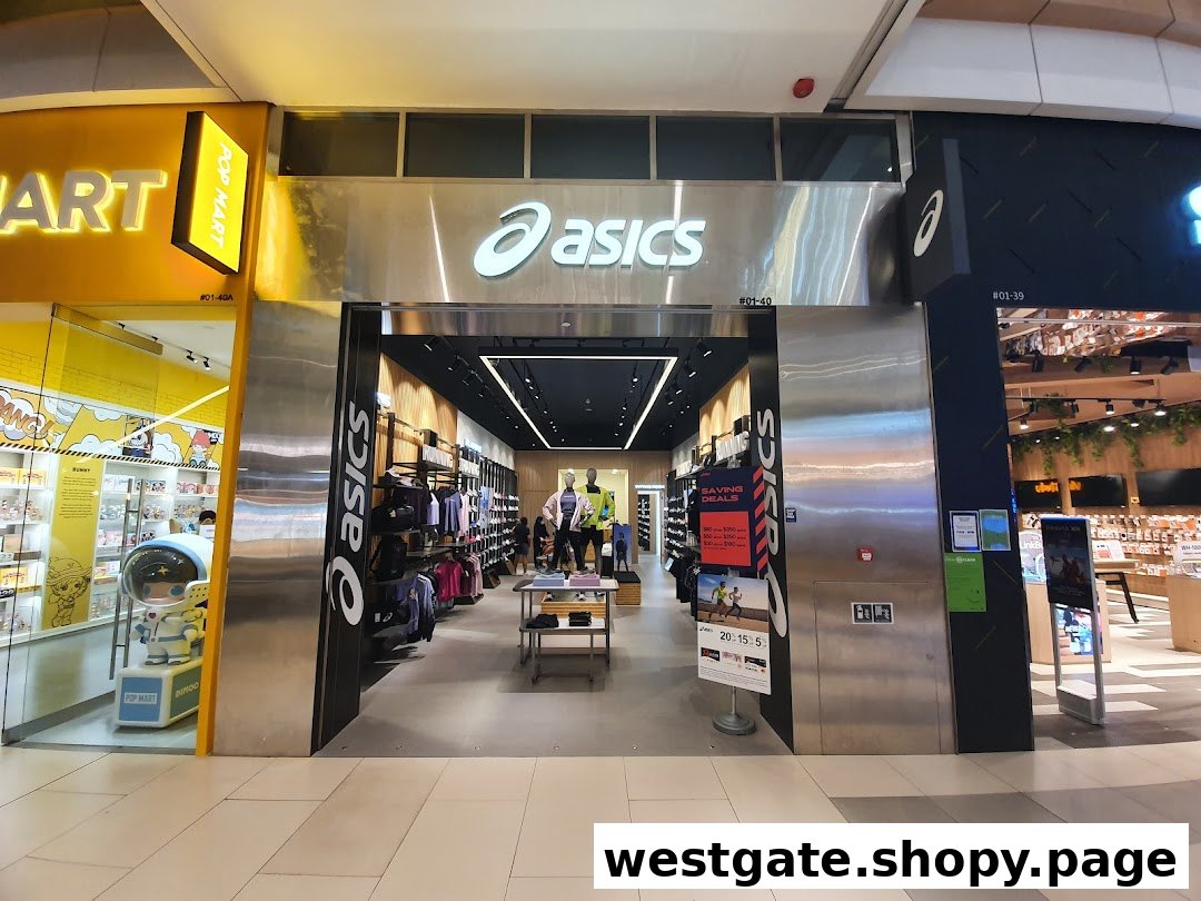 The ASICS retail store entrance, showcasing its prominent logo and a glimpse of athletic apparel and footwear inside.