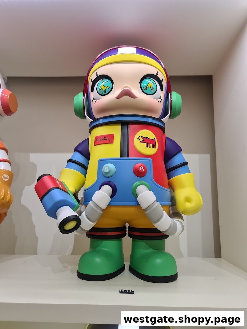 A large, colorful astronaut art toy, possibly a Keith Haring collaboration, displayed in a retail setting.