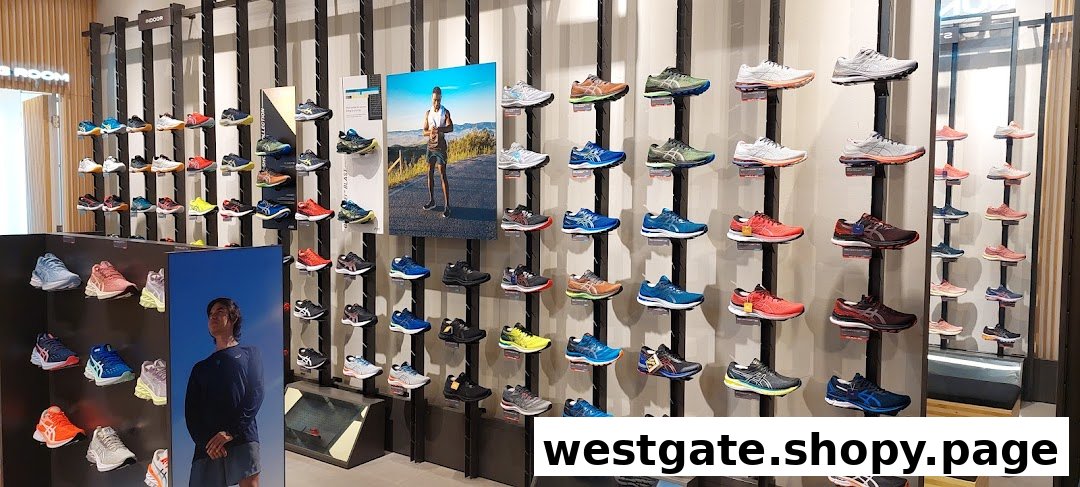 A vibrant display of ASICS athletic shoes in various colors and styles on a retail store wall.