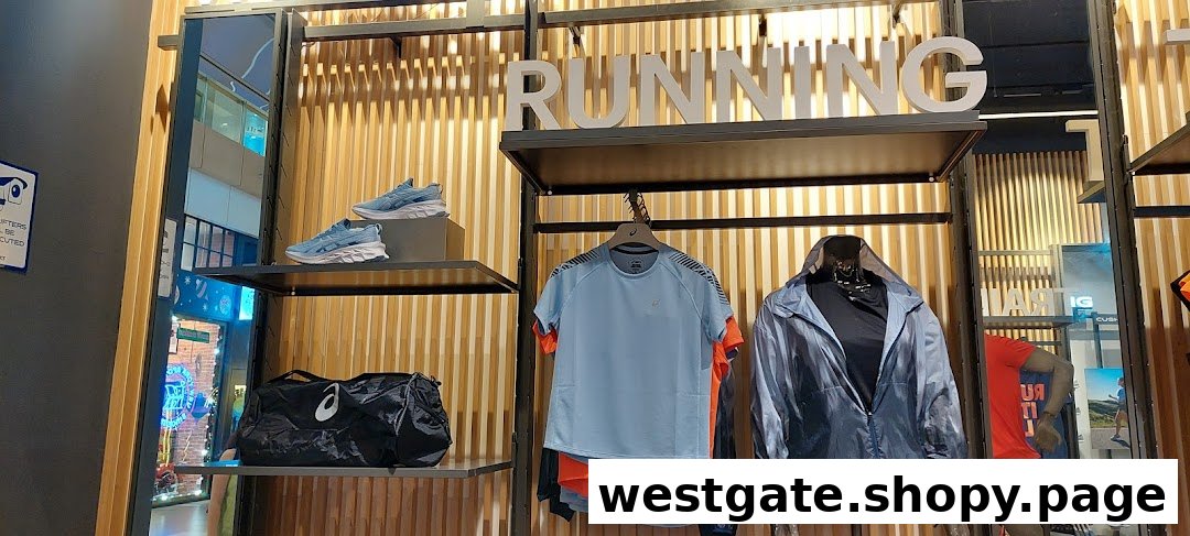 ASICS store interior showcasing running shoes, apparel, and accessories on display shelves.