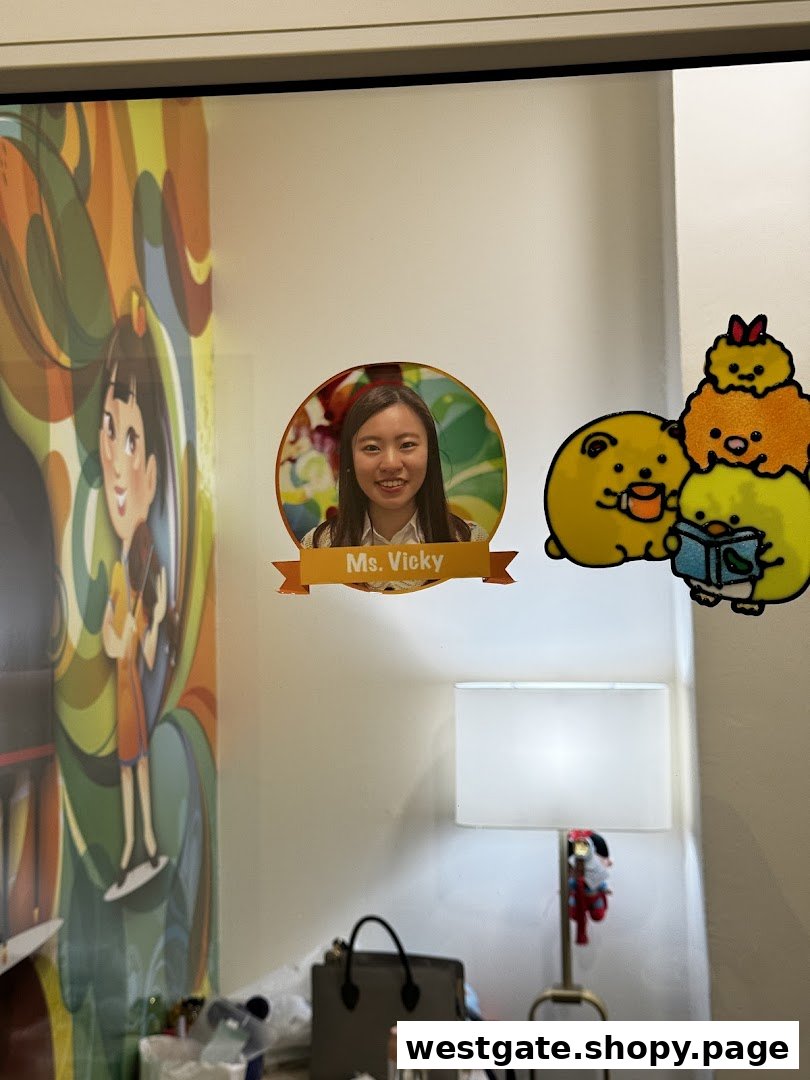 An interior shot of Aureus Academy featuring a staff photo of Ms. Vicky and cute cartoon decals.