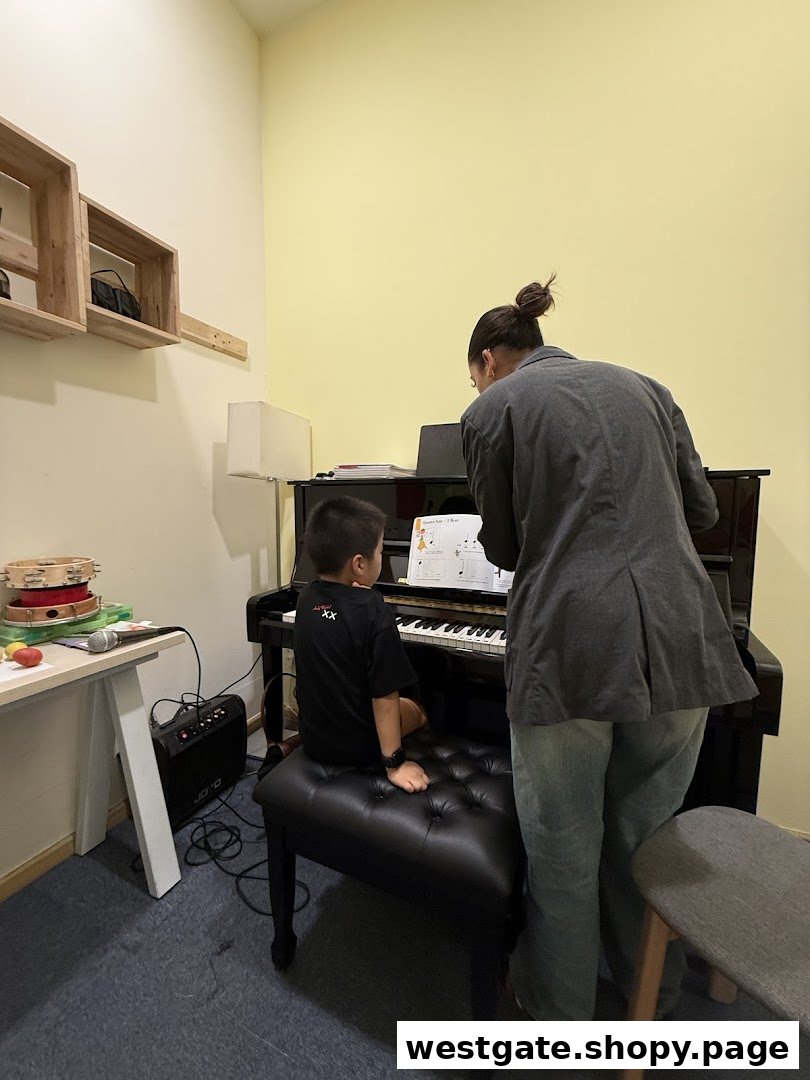 A child and an adult engaged in a piano lesson, with sheet music visible on the piano.