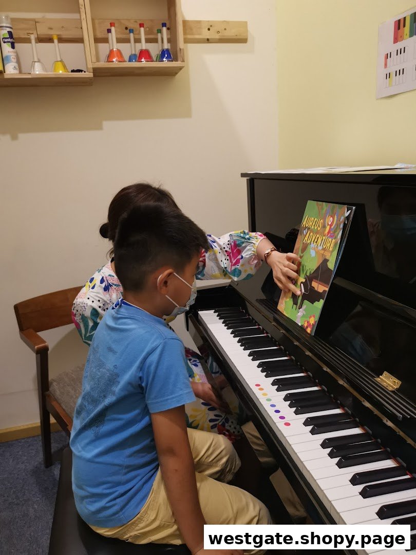 A teacher guides a student during a piano lesson at Aureus Academy, featuring musical instruments.
