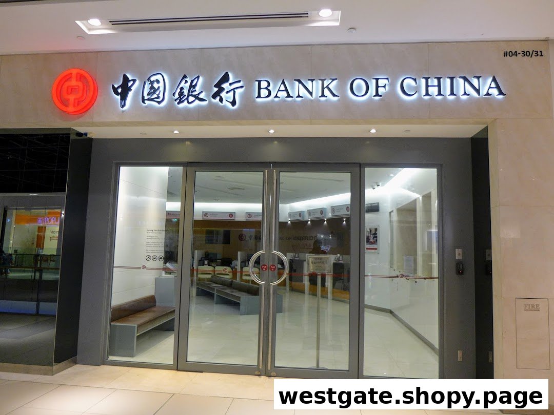 The illuminated exterior of Bank of China Jurong East Sub-Branch with its glass entrance.