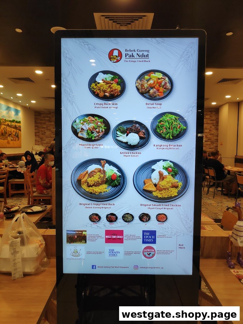 A digital menu board displaying various Indonesian dishes and restaurant information.