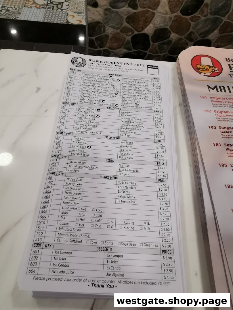 A detailed menu from Bebek Goreng Pak Ndut, showcasing a variety of Indonesian dishes and drinks.