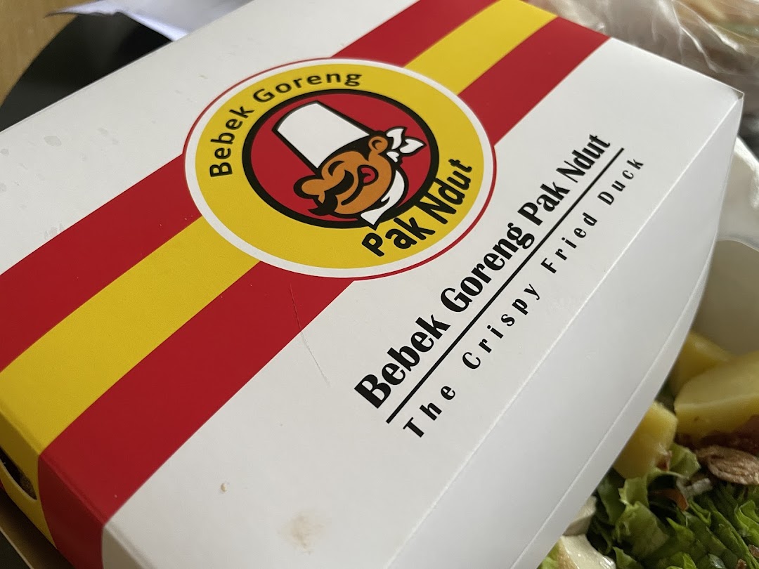 A branded takeaway box from Bebek Goreng Pak Ndut, featuring their signature crispy fried duck.