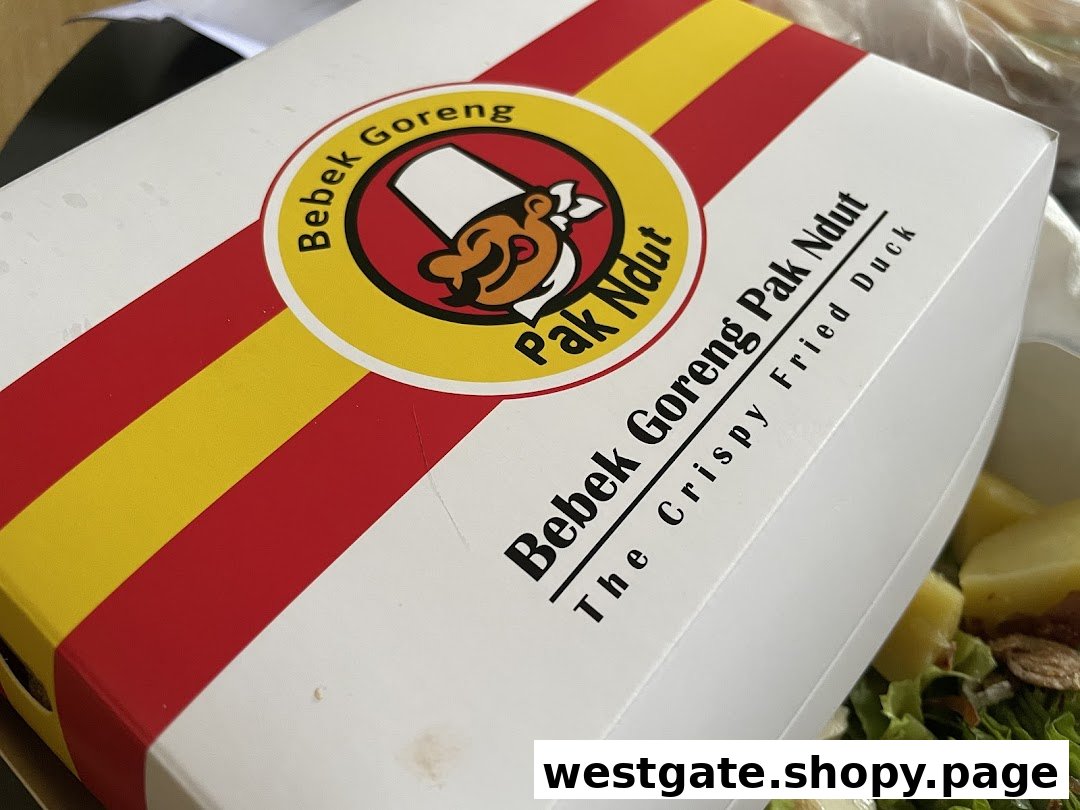 A branded takeaway box from Bebek Goreng Pak Ndut, featuring their signature crispy fried duck.