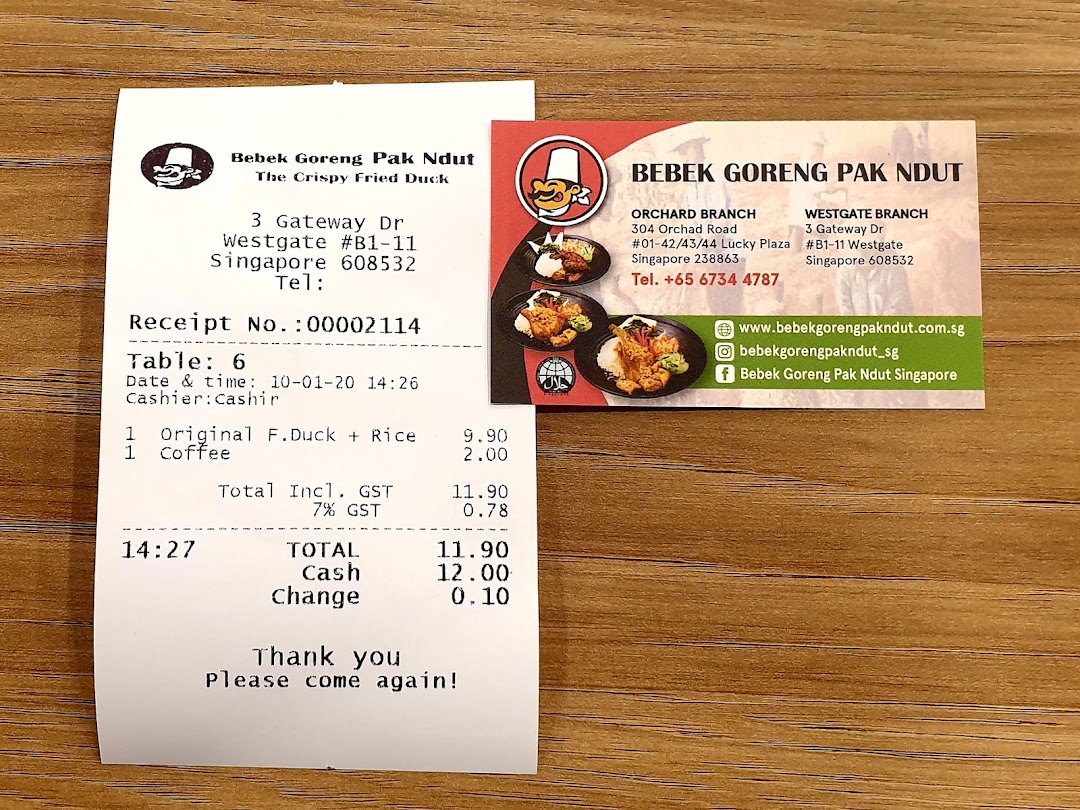 A receipt and business card for Bebek Goreng Pak Ndut, featuring contact details and branch information.