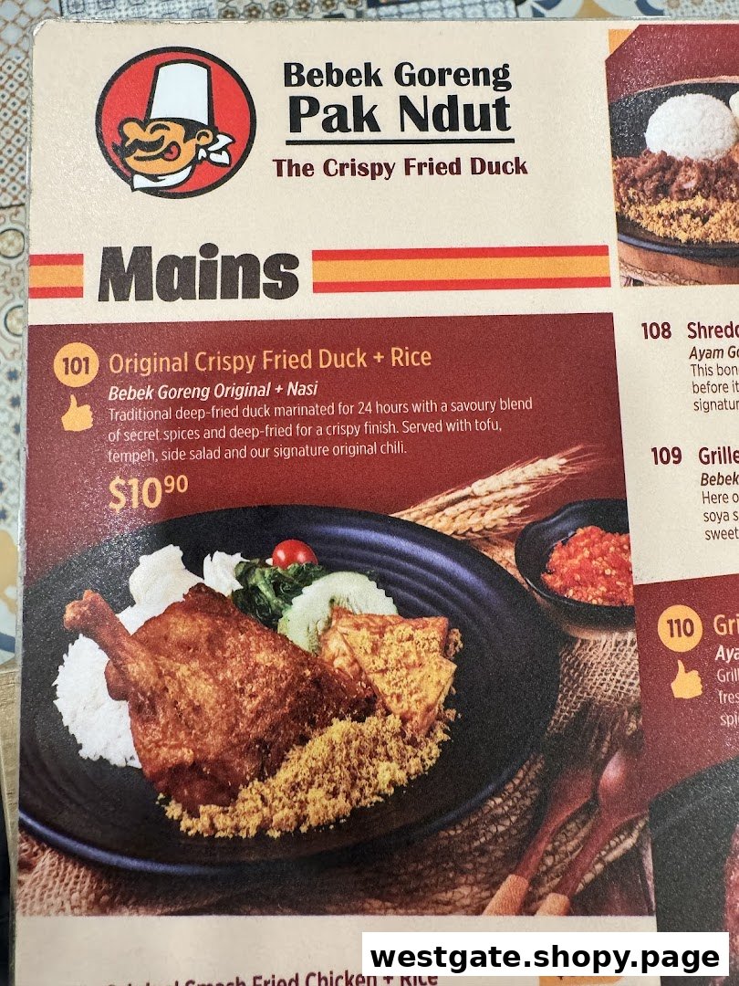A close-up of Bebek Goreng Pak Ndut's menu, featuring their signature crispy fried duck.
