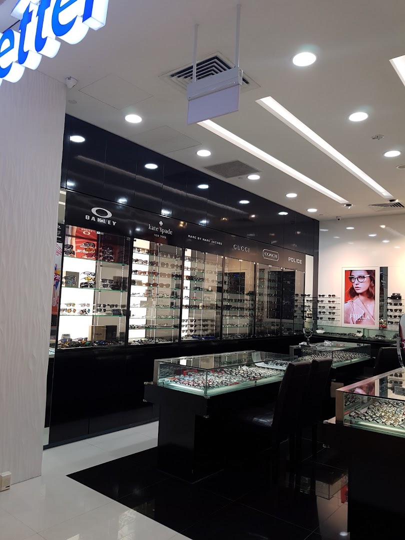 Interior view of Better Vision optical shop, showcasing extensive displays of designer eyewear and sunglasses.