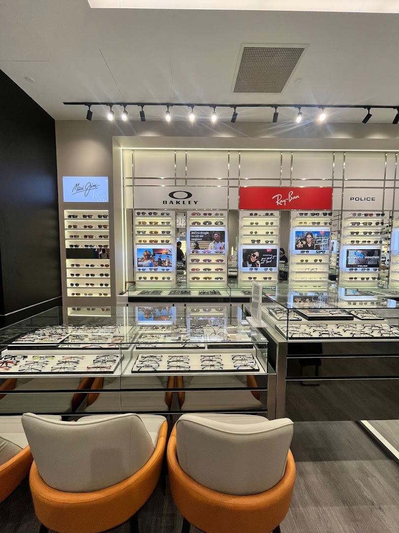Interior view of Better Vision eyewear store, showcasing various glasses and sunglasses displays with seating.