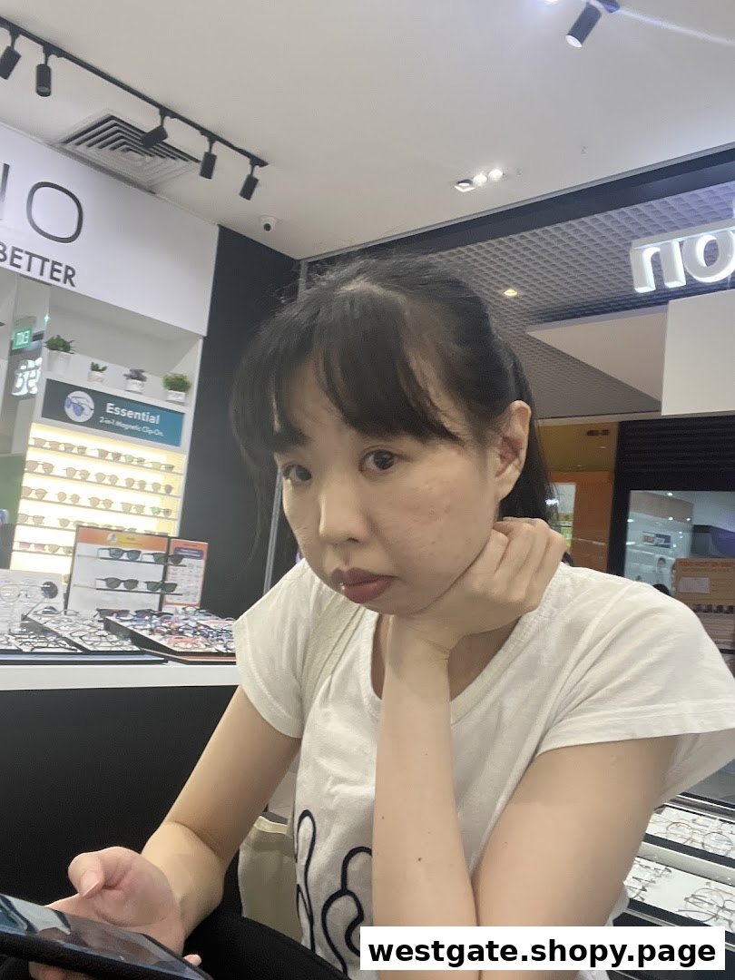 A customer browsing eyewear displays inside Better Vision, featuring magnetic clip-on options.