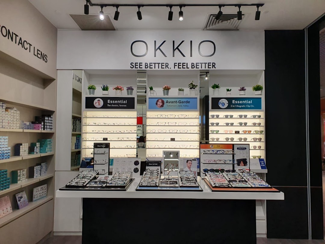 An interior display of OKKIO at Better Vision, showcasing a wide range of eyeglasses and contact lenses.