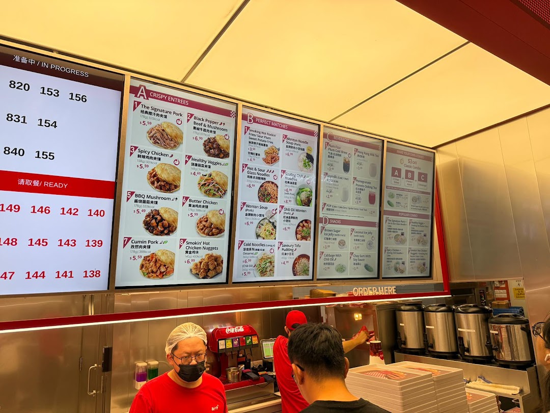 A vibrant digital menu board at Bingz Singapore showcasing a variety of Chinese street food and combo options.