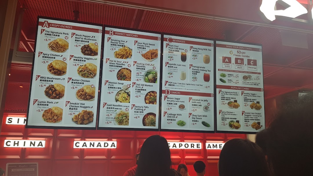 A brightly lit digital menu board showcasing a variety of Chinese street food, drinks, and combo meals.