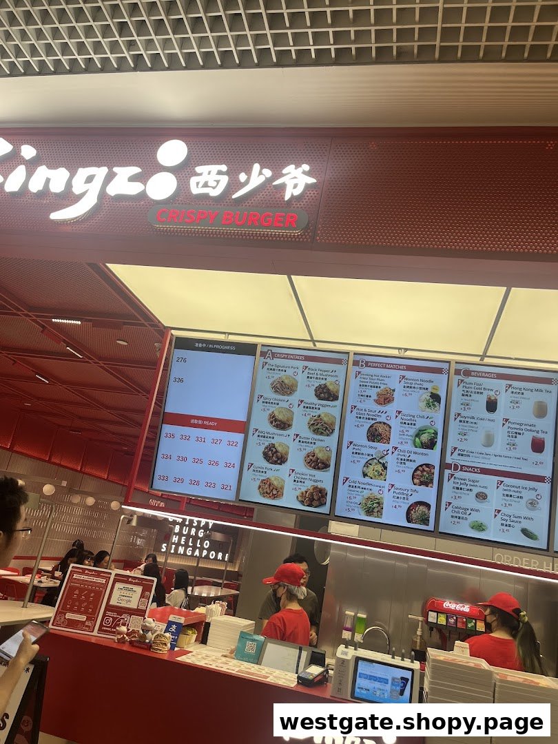 Interior view of Bingz Singapore, showing the ordering counter, staff, and digital menu boards.
