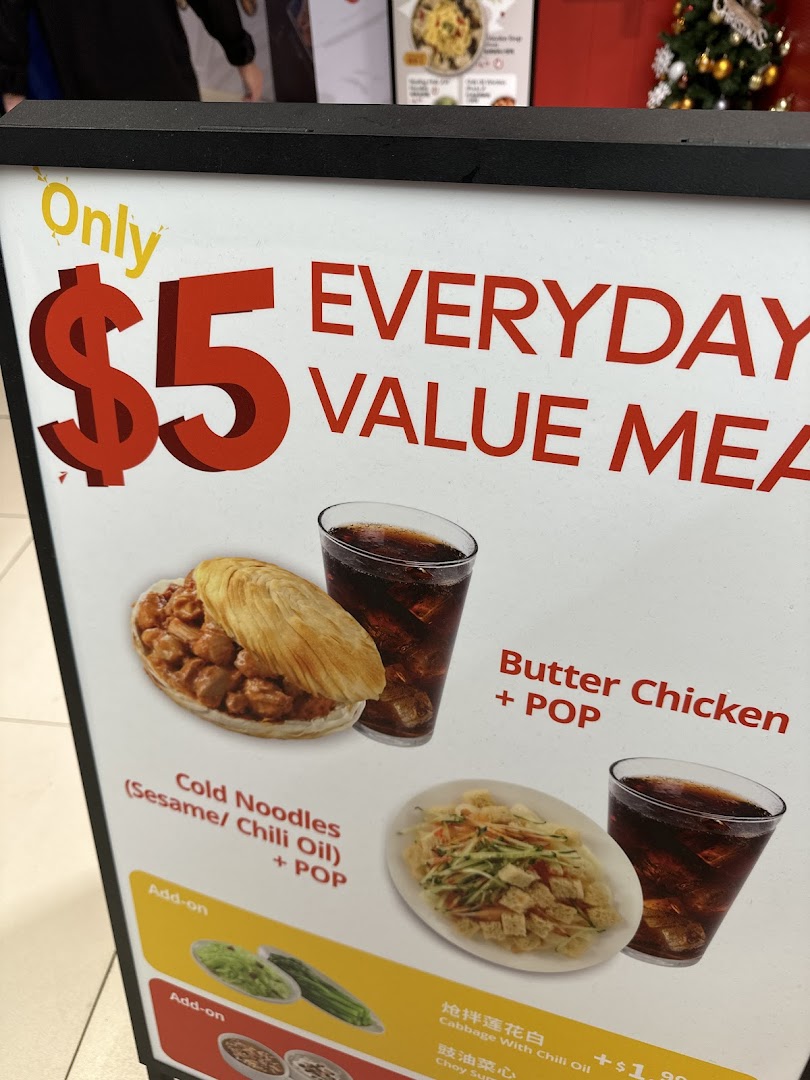 A promotional sign showcasing Bingz's $5 Everyday Value Meals, featuring Butter Chicken and Cold Noodles.