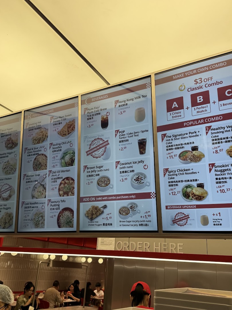 A vibrant digital menu board showcasing a variety of Chinese street food, beverages, and combo meals.