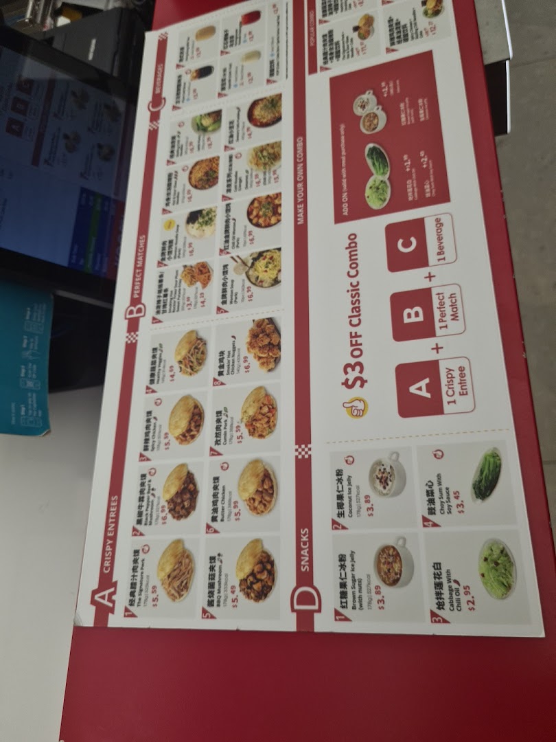 A detailed menu board displaying various Chinese dishes, snacks, and beverages with prices.