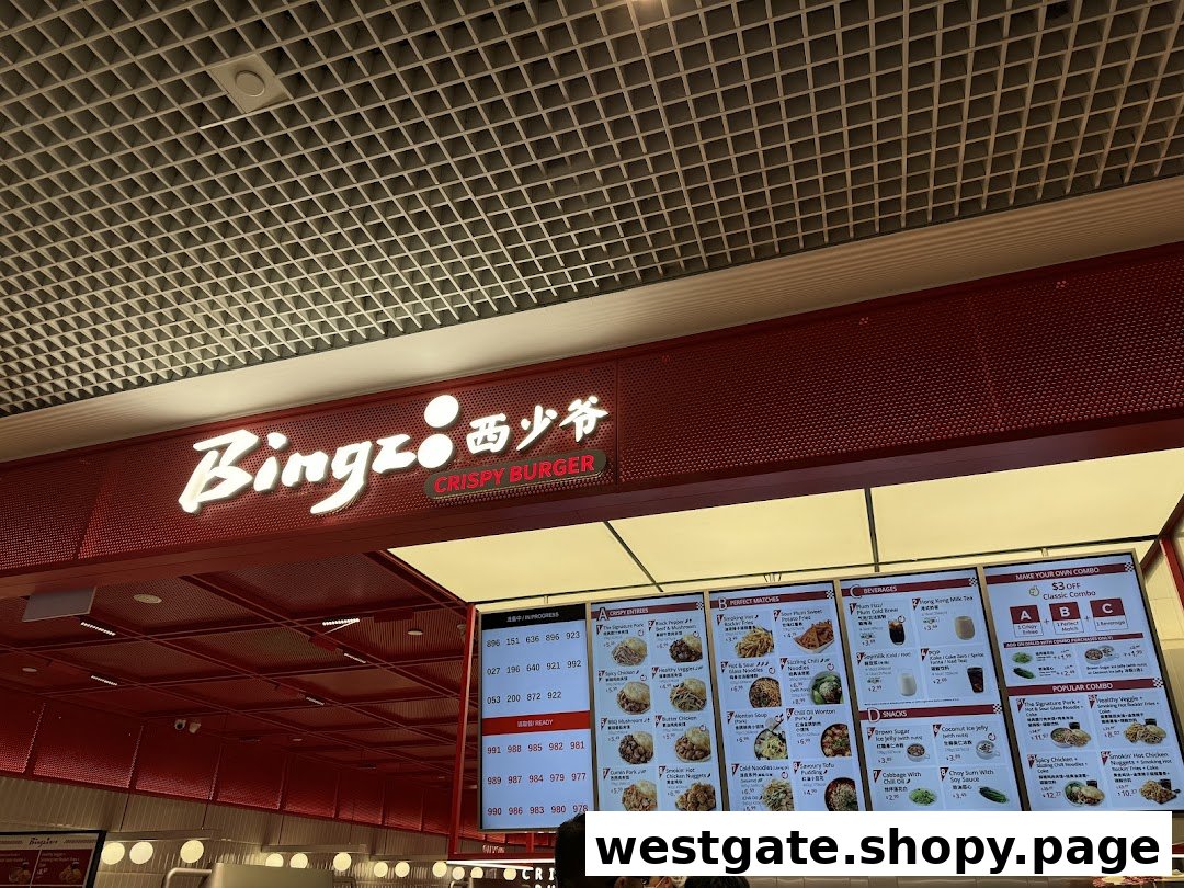 Interior view of Bingz Singapore, showcasing its vibrant red branding, menu boards, and order counter.