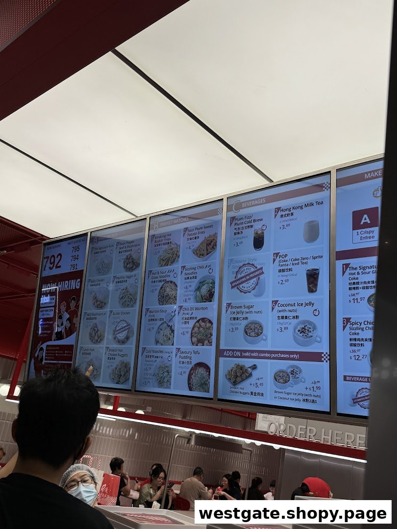 A digital menu board displaying a variety of Chinese dishes, sides, beverages, and combo meals.