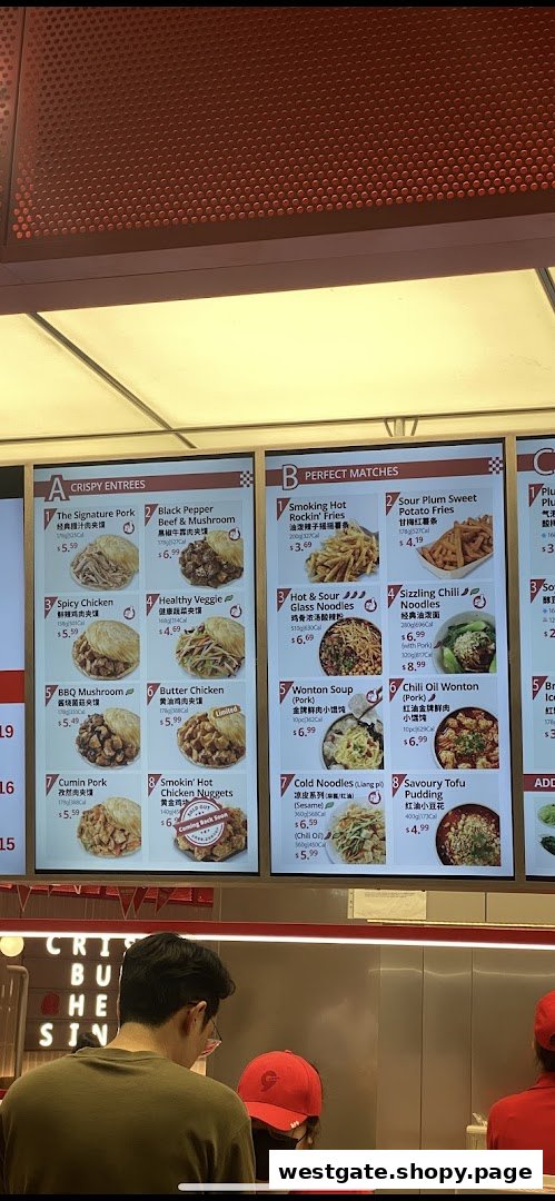 A digital menu board showcasing crispy entrees and perfect match side dishes with prices and images.
