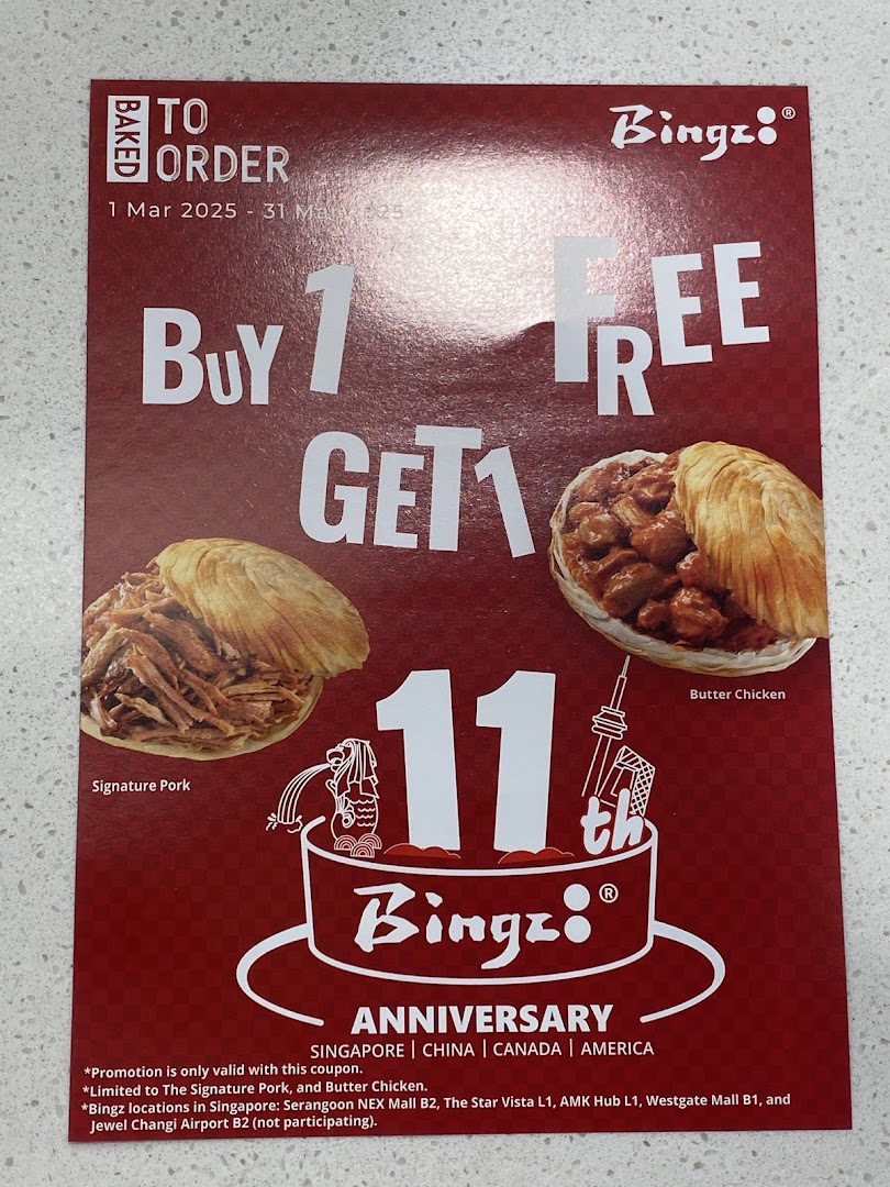 A red promotional flyer for Bingz's 11th anniversary, featuring a Buy 1 Get 1 Free offer on Signature Pork and Butter Chicken.