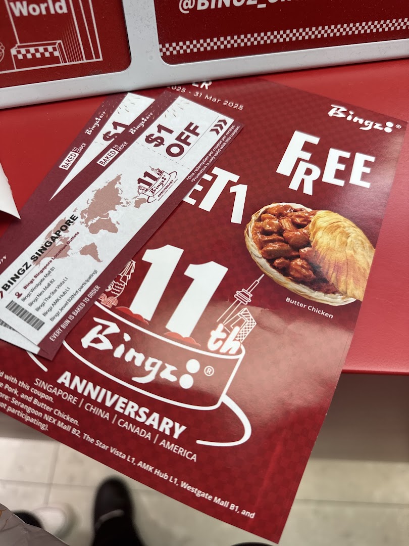 Promotional flyers for Bingz's 11th Anniversary, featuring discount coupons and a Buy 1 Get 1 Free offer.