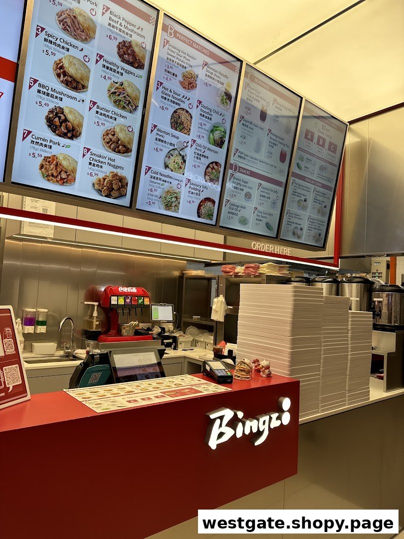A vibrant counter area of Bingz, showcasing large digital menu boards with various food and drink options.