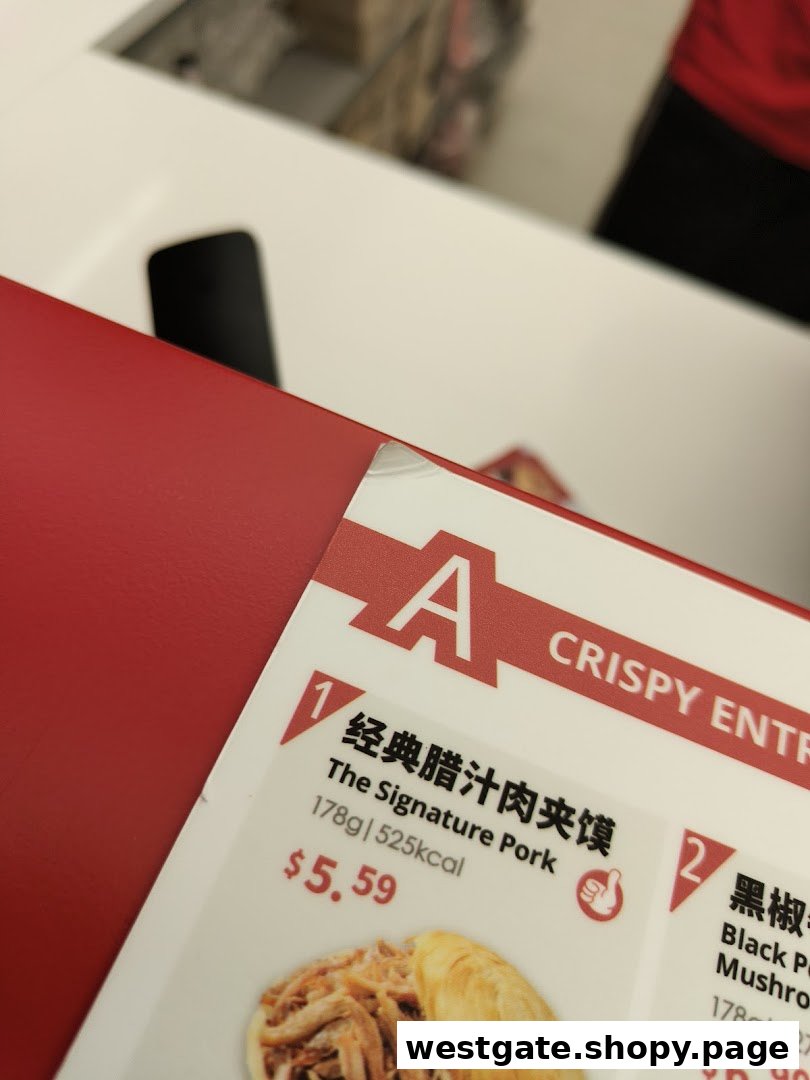 A close-up of Bingz Singapore's menu, featuring 'The Signature Pork' crispy entree with its price and nutritional information.