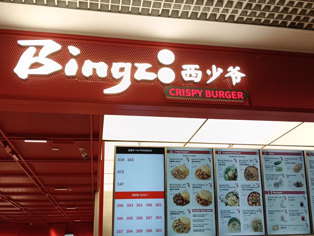 The shop front of Bingz Singapore, featuring its vibrant red signage, menu board, and order display.