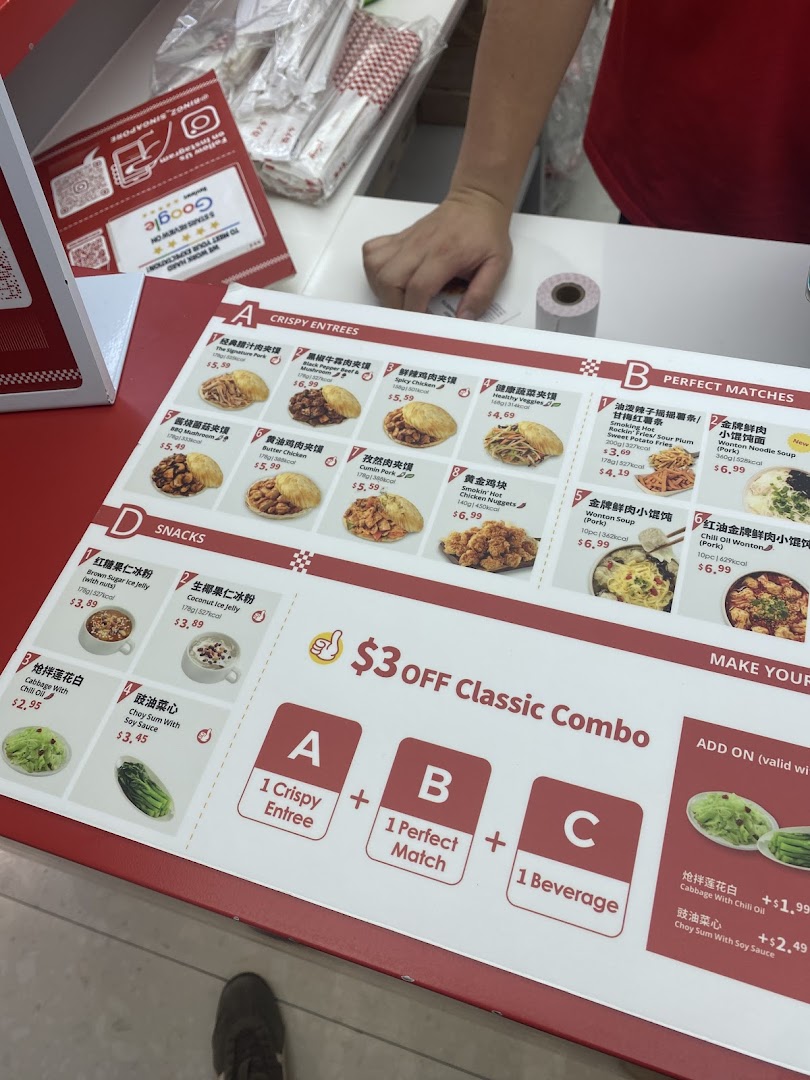 A detailed menu board displaying various crispy entrees, perfect matches, snacks, and combo deals.