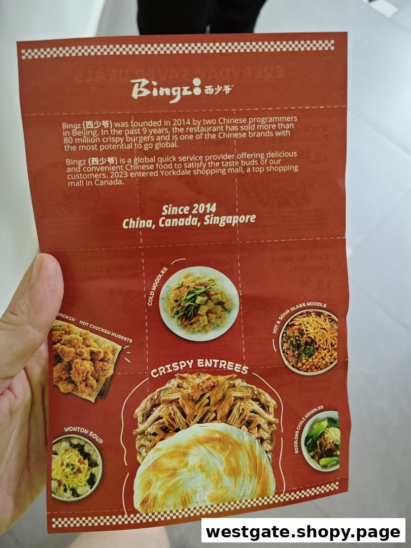 A close-up of Bingz Singapore's vibrant red menu, showcasing their signature crispy entrees and noodle dishes.