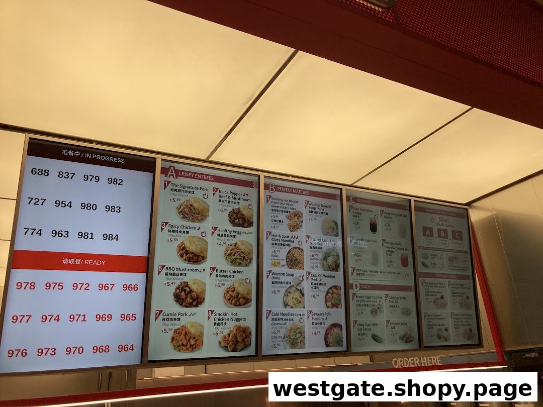 A digital menu board displaying various Chinese street food items, beverages, and combo deals, alongside a queue number system.