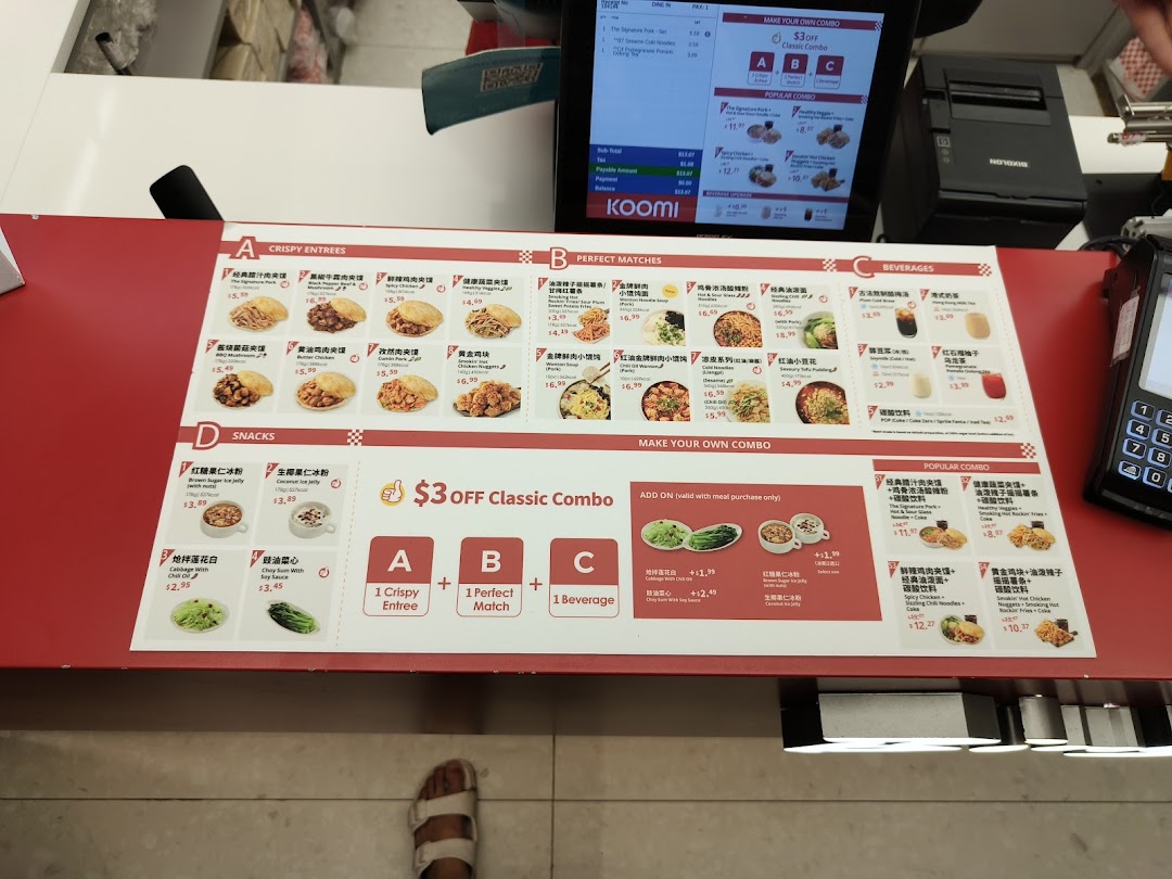 A detailed menu board displaying various Chinese entrees, sides, beverages, and combo meals at a counter.