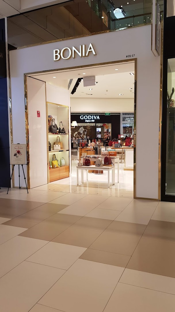 The elegant entrance of Bonia, showcasing a collection of stylish handbags and accessories.